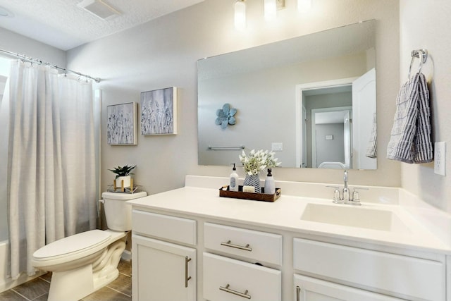 full bathroom with a textured ceiling, toilet, vanity, and shower / tub combo with curtain