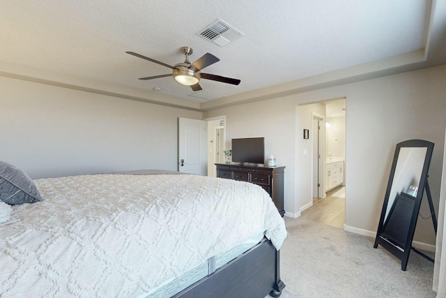 bedroom with ceiling fan and light colored carpet