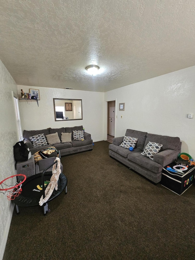 living room with a textured ceiling and carpet