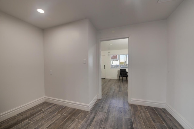 hall with dark hardwood / wood-style floors