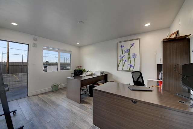 home office with hardwood / wood-style flooring