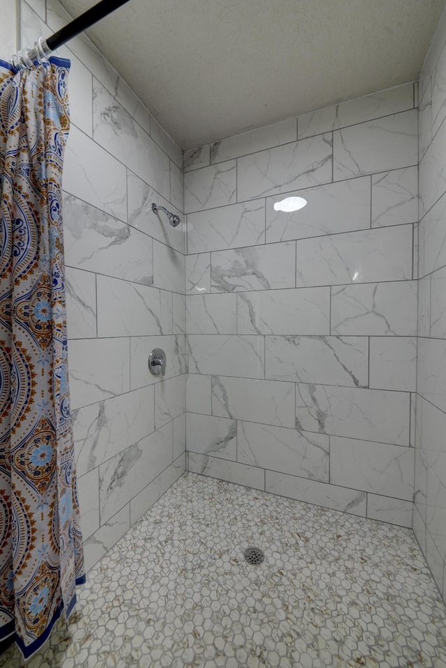 bathroom with a shower with curtain