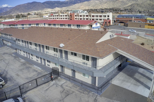 birds eye view of property with a mountain view