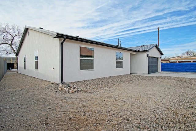 view of side of property featuring a garage