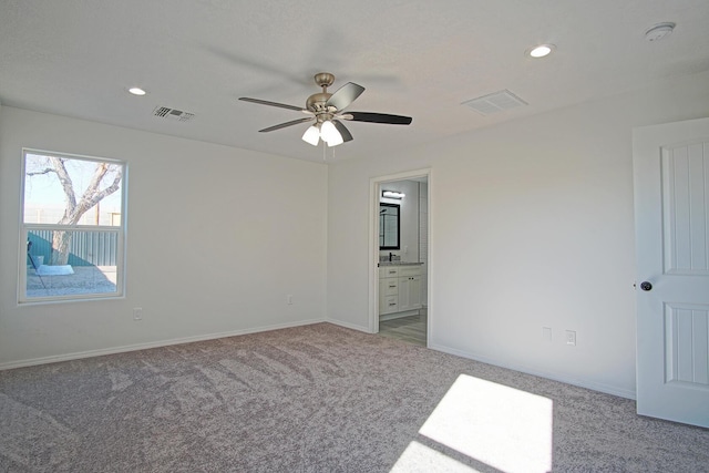 carpeted empty room with ceiling fan