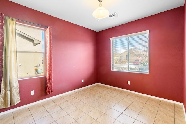 empty room with tile patterned floors