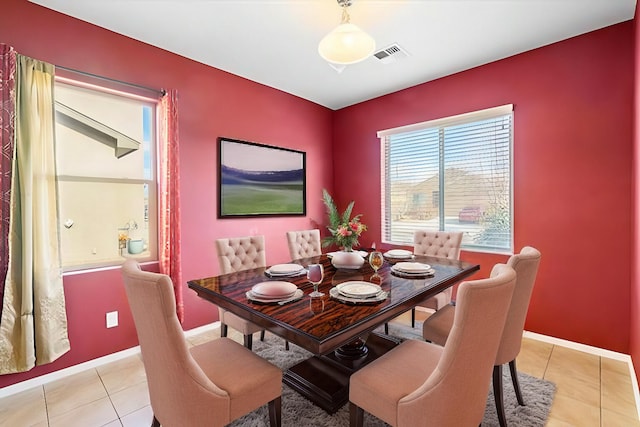 dining room with light tile patterned flooring