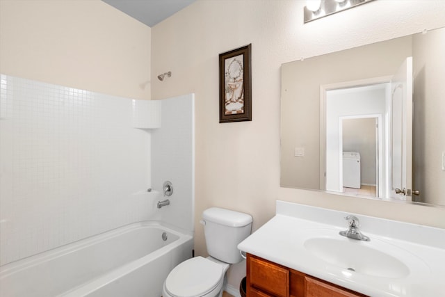 full bathroom featuring washer / clothes dryer, toilet, vanity, and bathing tub / shower combination