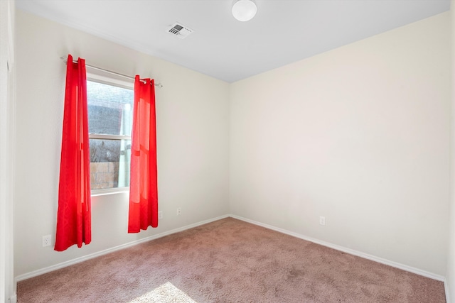 spare room featuring carpet floors