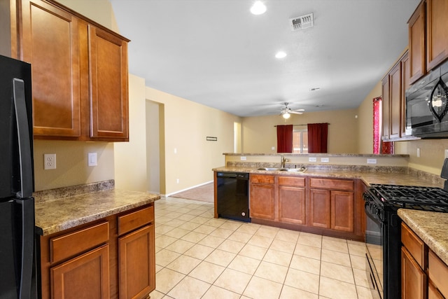 kitchen featuring sink, black appliances, light tile patterned floors, and ceiling fan