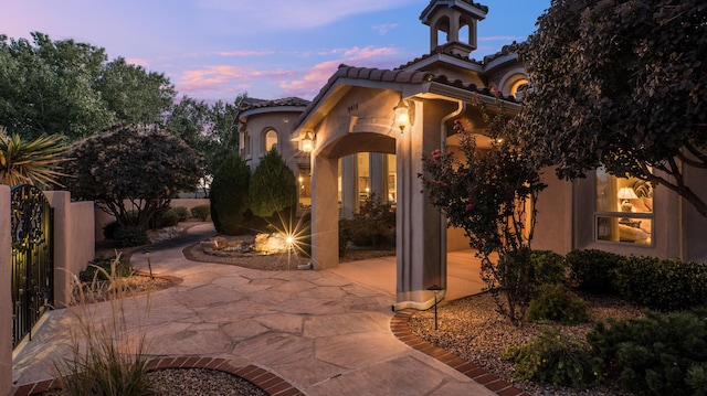 view of patio terrace at dusk