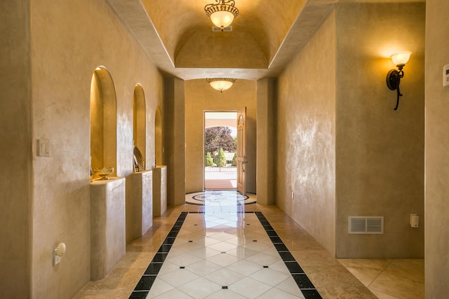 doorway to outside with vaulted ceiling