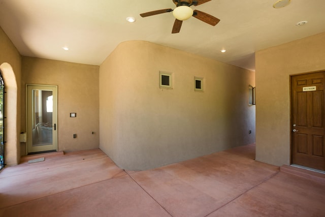 property entrance with ceiling fan