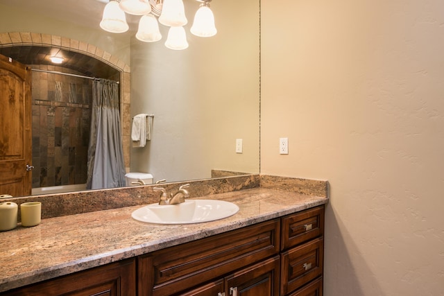 bathroom with vanity and curtained shower