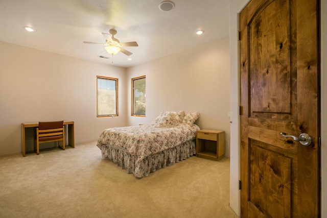 carpeted bedroom featuring ceiling fan