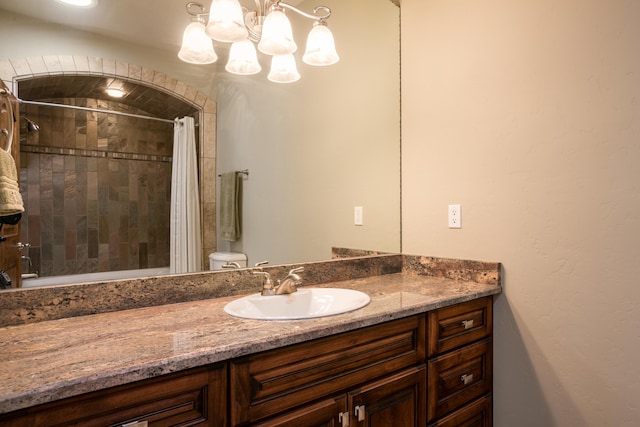 bathroom with vanity, toilet, and walk in shower