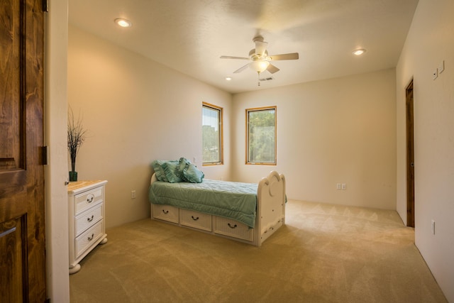 carpeted bedroom featuring ceiling fan