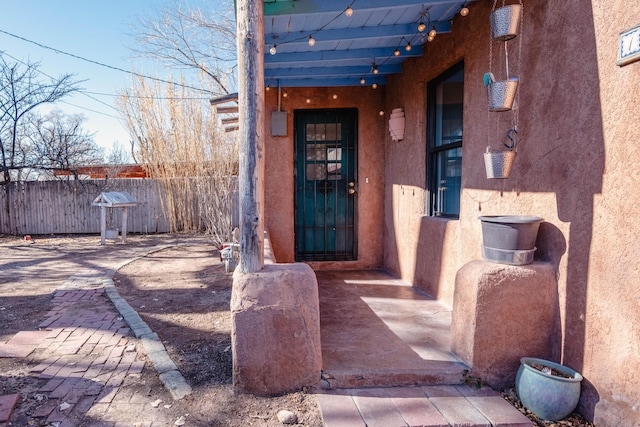 doorway to property featuring a patio area