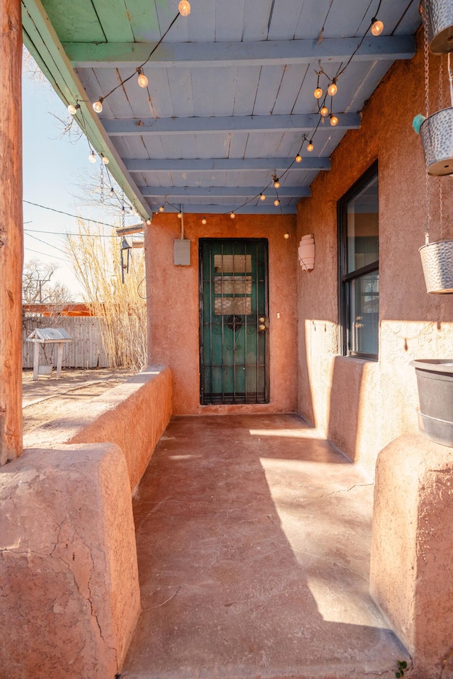 doorway to property with a patio