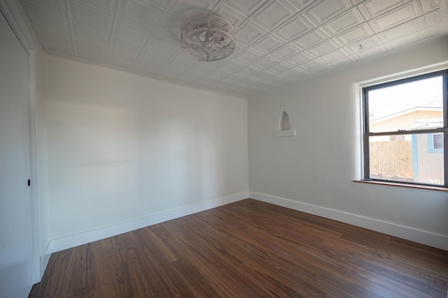 empty room with dark hardwood / wood-style floors