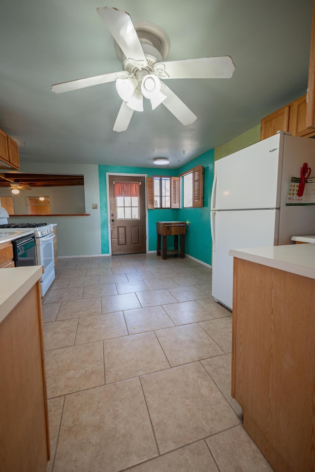 kitchen with ceiling fan, light tile patterned flooring, and white appliances