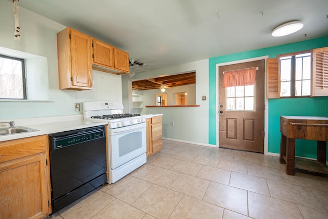 kitchen with light tile patterned flooring, black dishwasher, white range with gas stovetop, and sink