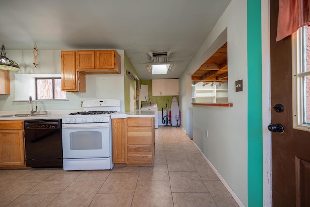 kitchen featuring decorative light fixtures, dishwasher, washer / clothes dryer, sink, and white range with gas cooktop