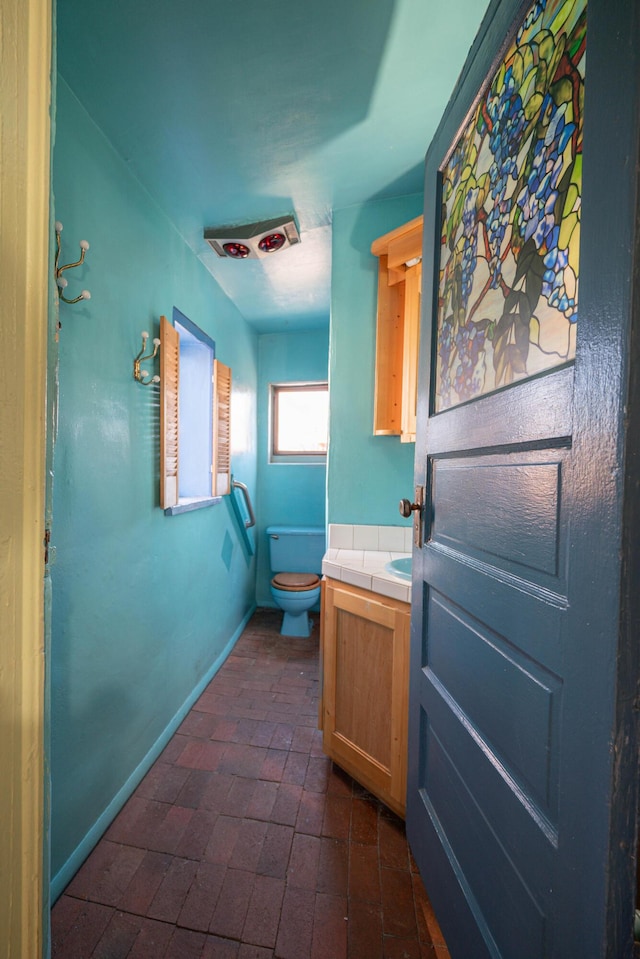 bathroom featuring toilet and vanity