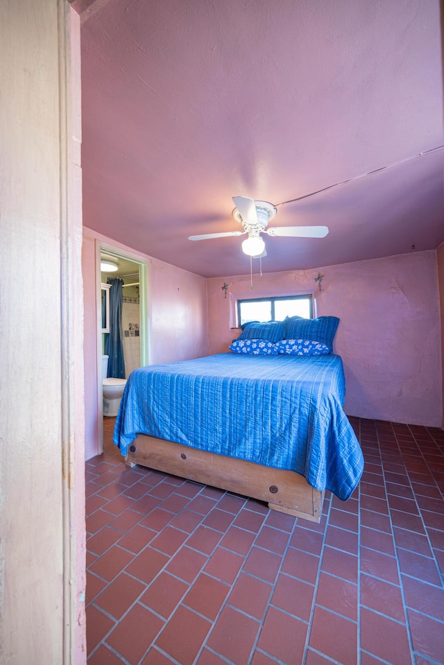 tiled bedroom featuring ceiling fan