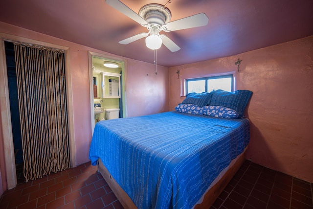 bedroom with ceiling fan and connected bathroom