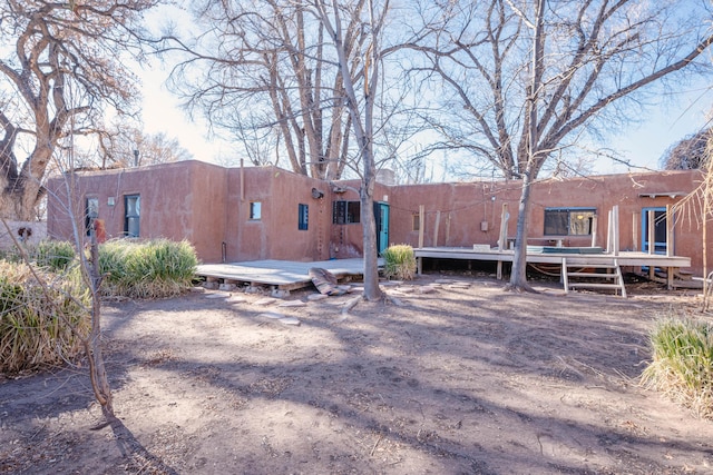 rear view of property with a deck