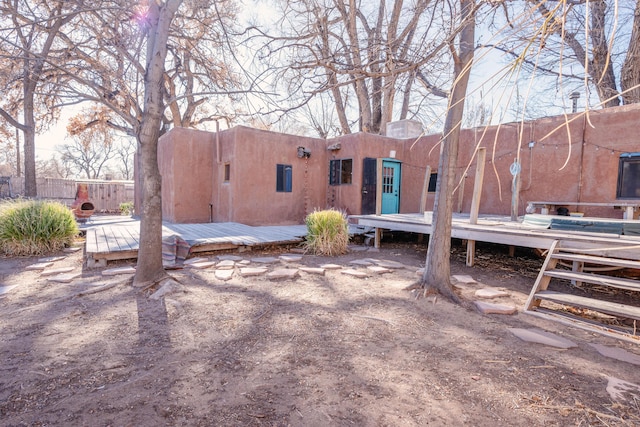 rear view of property with a deck