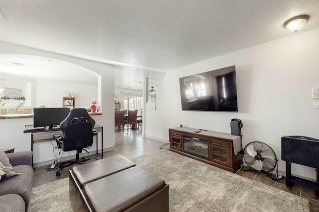 living room featuring a textured ceiling