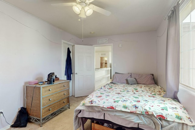 carpeted bedroom with ceiling fan