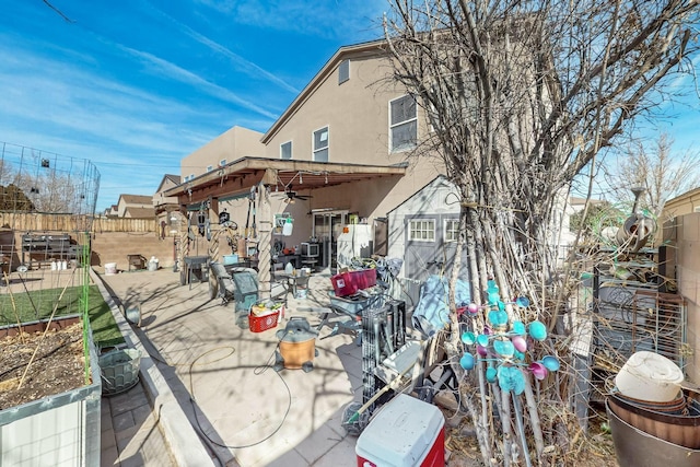 rear view of house featuring a patio