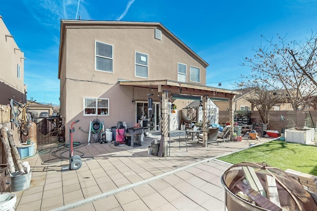 rear view of property featuring a patio