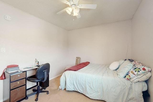 bedroom featuring ceiling fan and light carpet