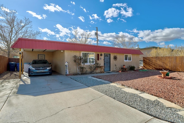 single story home with a carport