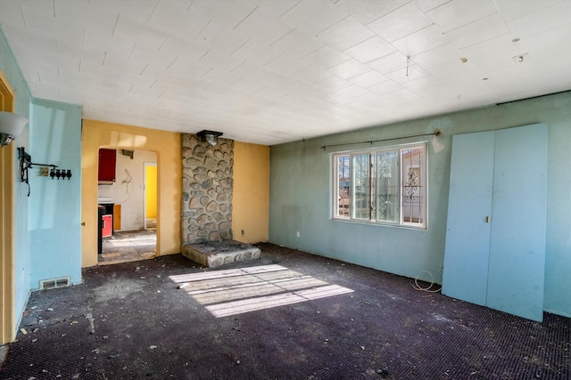 interior space with dark colored carpet