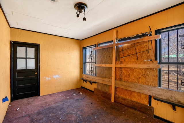 interior space with crown molding