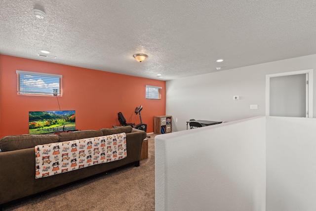 living room with light colored carpet and a textured ceiling