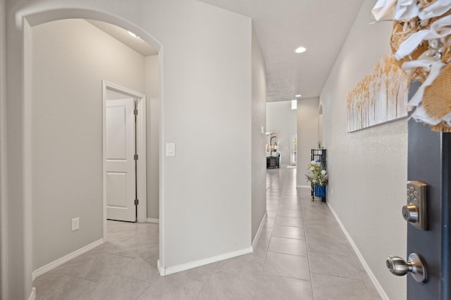 hallway with light tile patterned floors