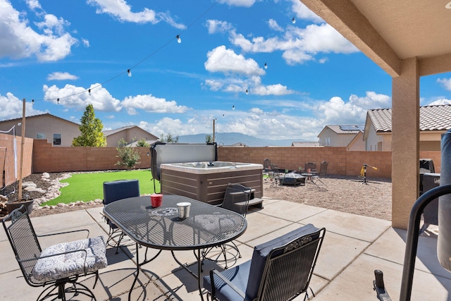 view of patio with a hot tub