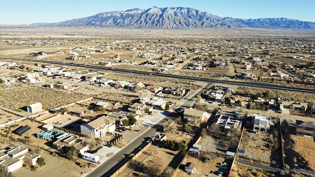 birds eye view of property featuring a mountain view