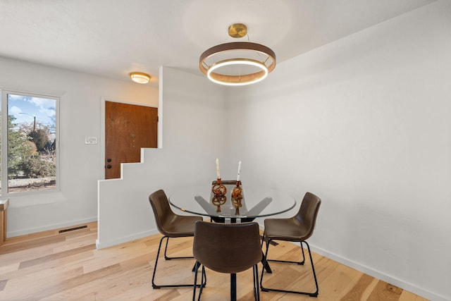 dining room with light wood-type flooring