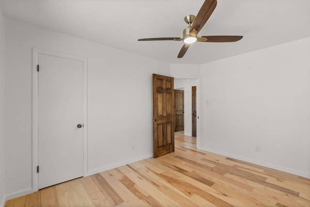 unfurnished bedroom featuring light hardwood / wood-style floors and ceiling fan