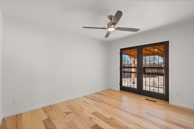 unfurnished room with light hardwood / wood-style flooring, french doors, and ceiling fan