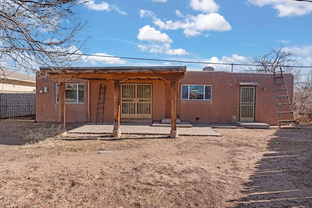 back of property featuring a patio area