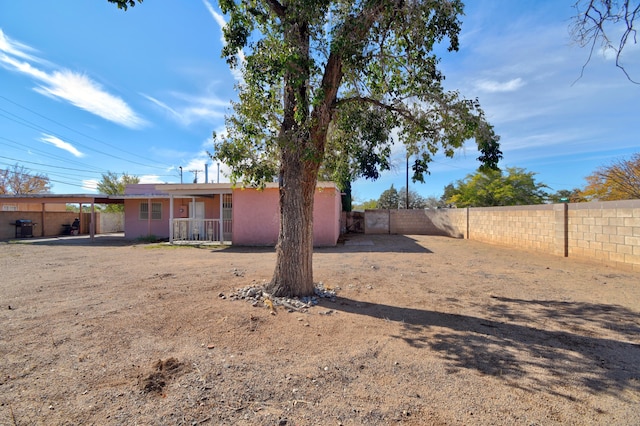 view of yard with a carport