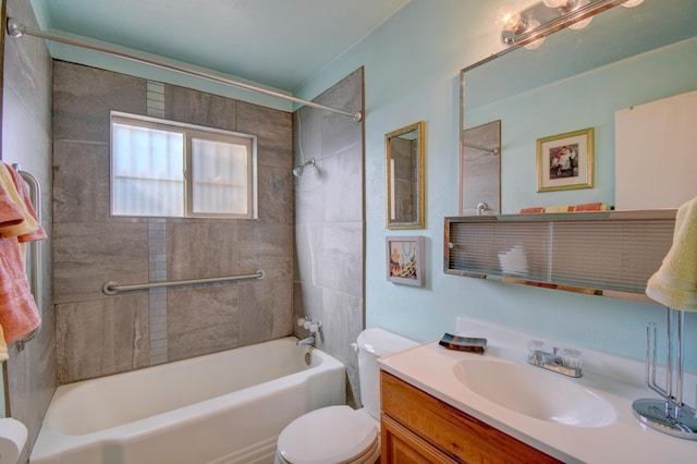 full bathroom featuring toilet, vanity, and tiled shower / bath